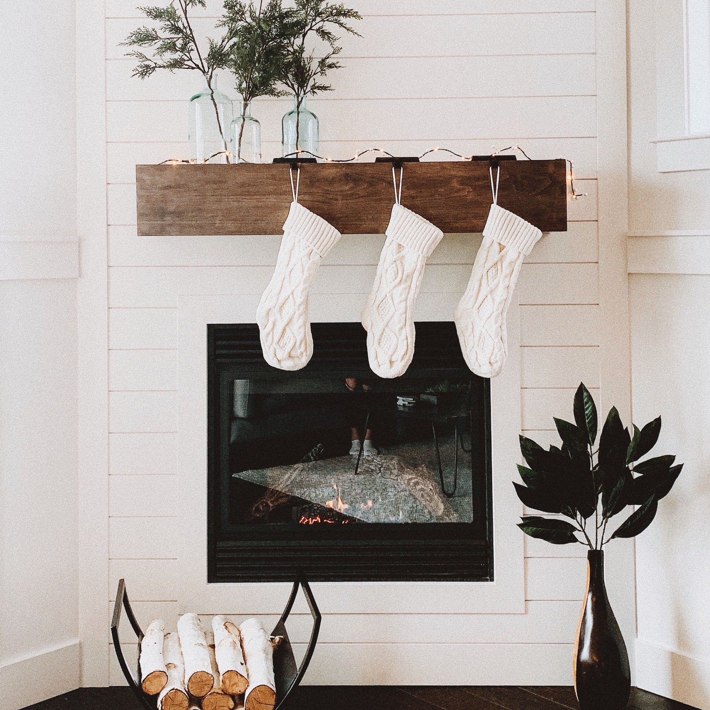 Empty Hand Knit Christmas Stockings over a fireplace